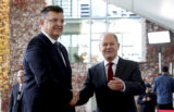 German Chancellor Olaf Schol, right, welcomes the Chairman of the Council of Ministers of Bosnia and Herzegovina, Zoran Tegeltija, left, for the 'Western Balkans' conference at the Chancellery in Berlin, Germany