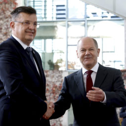German Chancellor Olaf Schol, right, welcomes the Chairman of the Council of Ministers of Bosnia and Herzegovina, Zoran Tegeltija, left, for the 'Western Balkans' conference at the Chancellery in Berlin, Germany