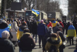 Russia Ukraine Abducted Mayors People with Ukrainian flags walk towards Russian army trucks during a rally against the Russian occupation in Kherson, Ukraine, on March 20, 2022. As Russian forces sought to tighten their hold on Melitopol, hundreds of residents took to the streets to demand the mayor's release