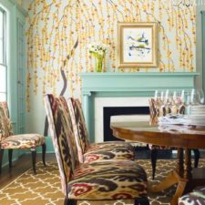 Eclectic dining room design floral wallpaper blue accents upholstered chairs.jpg