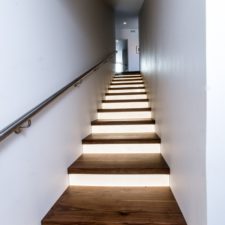 Elegant wooden staircase design with modern led lighting style.jpg