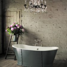 Splendid rustic french style bathroom interior with luxury chandelier rough walls and wooden floors.jpg