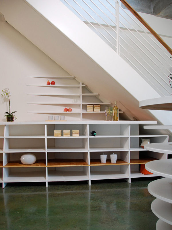 Stylish and chic shelves beneath the stairs.jpg