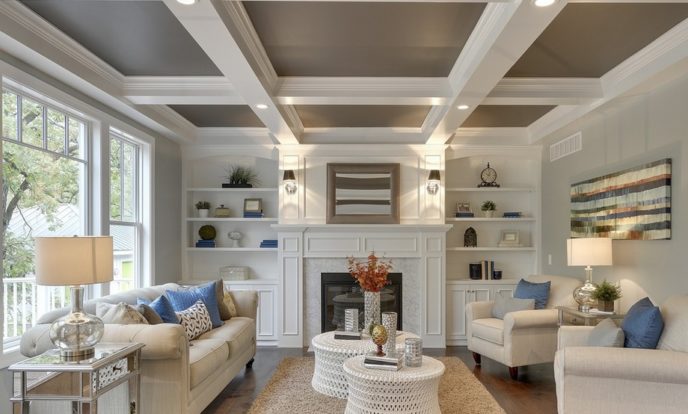 Coffer_ceiling__bookcase__built_in__mantle__living_room__white__sofa__pair_chairs__crown_molding__architecture__beautiful__blue__recessed_lighting_.png