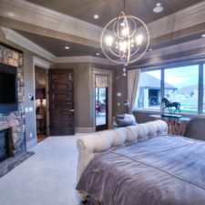 Eclectic master bedroom with stone fireplace i_g isp1up51phkjfk1000000000 2mun1.jpg