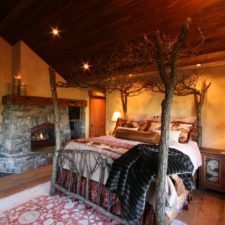 Rustic master bedroom with stone fireplace i_g is1zvahzqwg6h50000000000 p1dcu.jpg