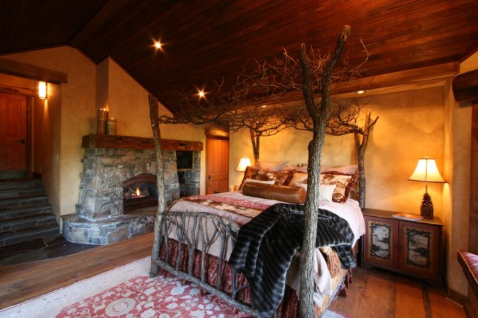 Rustic master bedroom with stone fireplace i_g is1zvahzqwg6h50000000000 p1dcu.jpg