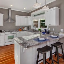 Contemporary kitchen with breakfast bar white granite and bamboo flooring i_g ist4rwgvo7zzdh0000000000 c7_nk.jpg