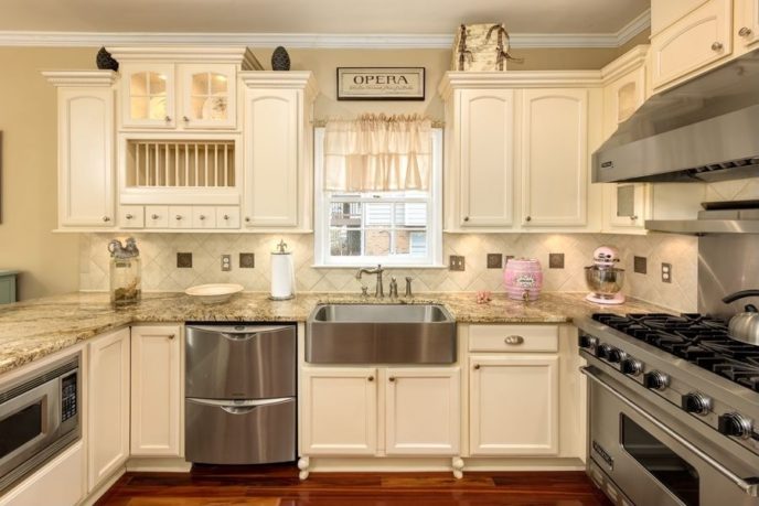 Cottage kitchen with white cabinets microwave cabinet and crown molding i_g is91z4jgor51r51000000000 ccwbw.jpg