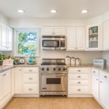 Country kitchen with mosaic tile and white cabinets i_g isxvybgy24o75z0000000000 p5xzp.jpg