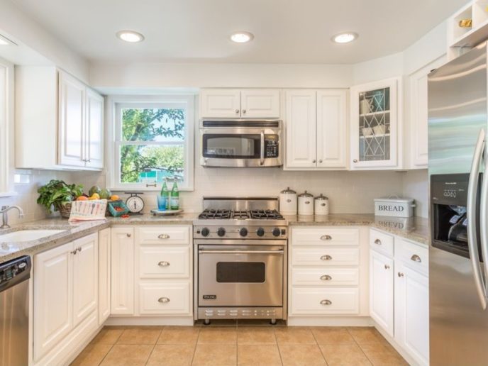 Country kitchen with mosaic tile and white cabinets i_g isxvybgy24o75z0000000000 p5xzp.jpg