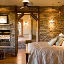 Post_rustic master bedroom with exposed beams stacked stone fireplace and double sided fireplace i_g ishrgmzn0t1hgs1000000000 patri.jpg