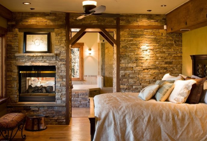 Post_rustic master bedroom with exposed beams stacked stone fireplace and double sided fireplace i_g ishrgmzn0t1hgs1000000000 patri.jpg