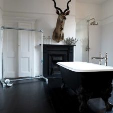 Bathroom wonderful black and white bathroom ideas for design inspirations with elegant black free standing bathtub furniture that have stainless steel faucets also stunning black wood fireplace design 978x1304.jpg