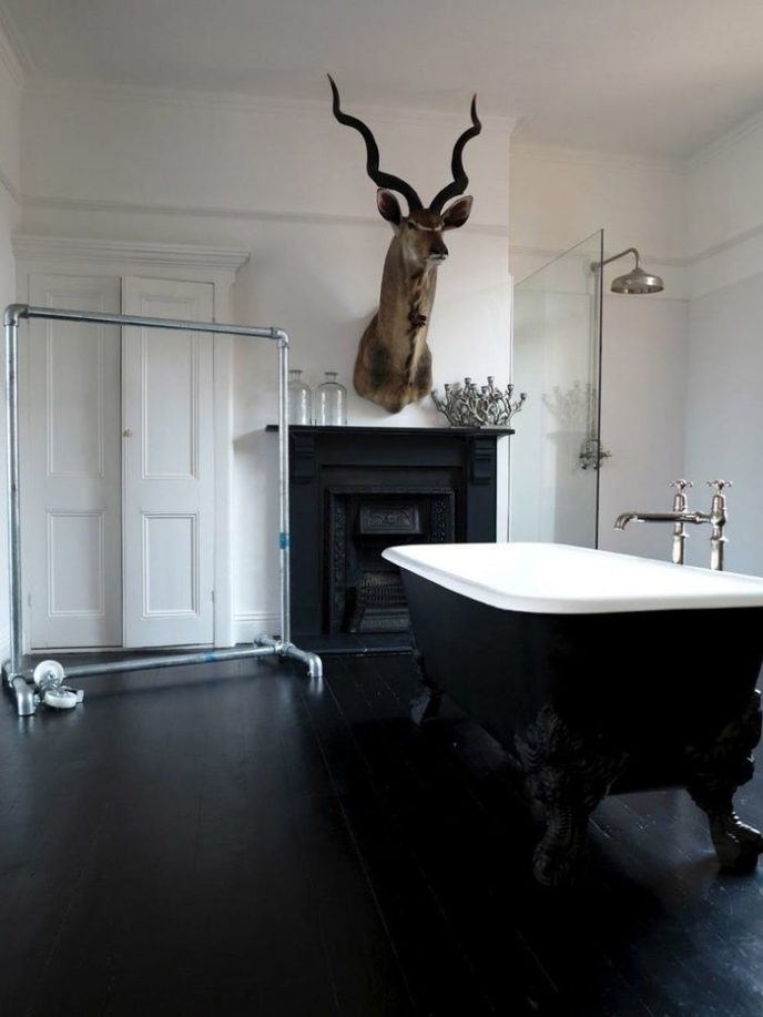 Bathroom wonderful black and white bathroom ideas for design inspirations with elegant black free standing bathtub furniture that have stainless steel faucets also stunning black wood fireplace design 978x1304.jpg