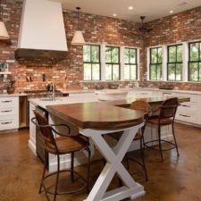 Post_appealing industrial brick kitchen brown color bricks wall white kitchen cabinets rectangle shape white kitchen island cream granite countertop white brown wooden colors table metal wick.jpg