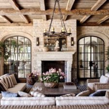 Post_country living room with exposed beams_ french doors_ and stone walls i_g isp59grotvq8s40000000000 u7mib.jpg