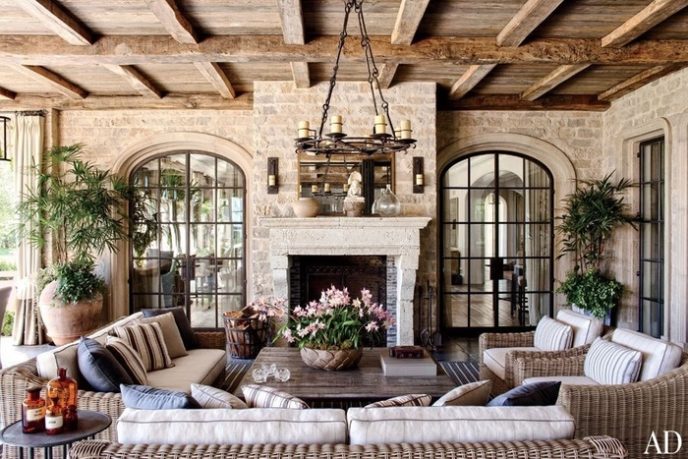 Post_country living room with exposed beams_ french doors_ and stone walls i_g isp59grotvq8s40000000000 u7mib.jpg