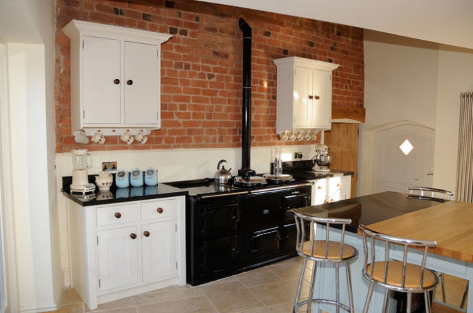 Post_pleasant white cabinet and black gas stove also red brick wall accent as brick kitchen idea1.jpg