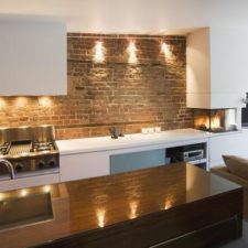 Post_pretty kitchen design with natural brick wall and white kitchen furniter color also glass fireplace as brick kitchen idea1.jpg