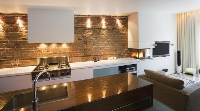 Post_pretty kitchen design with natural brick wall and white kitchen furniter color also glass fireplace as brick kitchen idea1.jpg