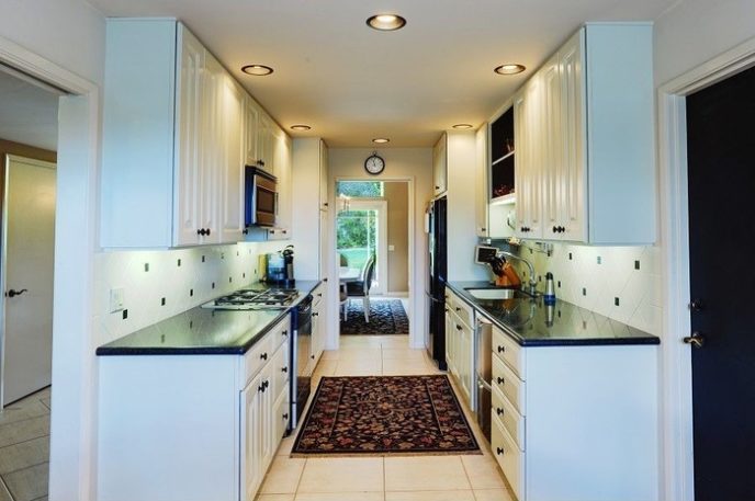 Post_traditional kitchen with white cabinets and black galaxy granite i_g is 2njc9jk5howt xfayl.jpg