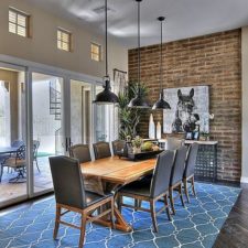 Post_color and pattern of the rug enliven the exposed brick wall dining room 1 1.jpg