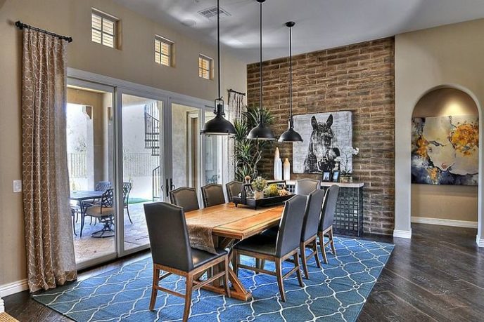 Post_color and pattern of the rug enliven the exposed brick wall dining room 1 1.jpg