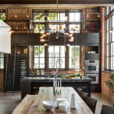 Post_industrial chandelier dining room industrial with brick walls clocktower building clocktower loft contemporary converted warehouse industrial large windows.jpg