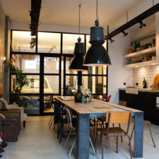 Post_industrial dining room table kitchen eclectic with bachelor pad black pendant.jpg