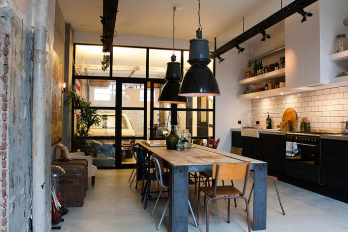 Post_industrial dining room table kitchen eclectic with bachelor pad black pendant.jpg