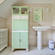 Post_bathroom cabinet vintage with farmhouse wood panel wall.jpg