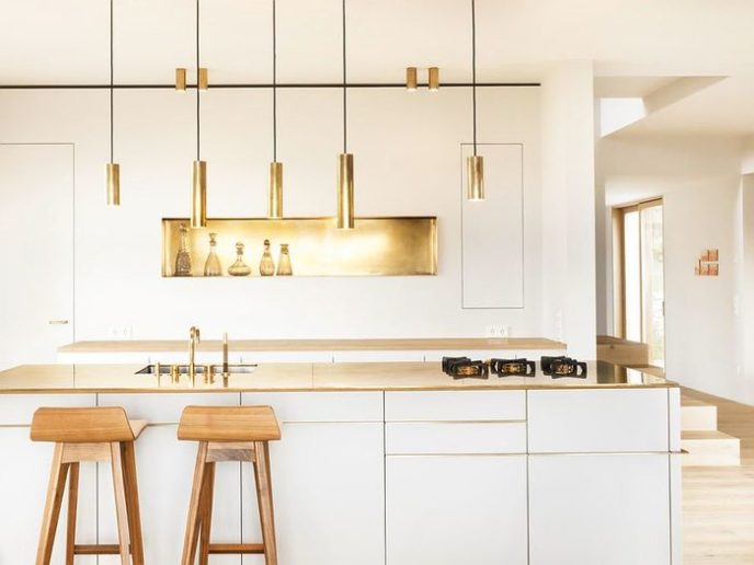 Post_minimalist scandinavian kitchen with golden accents also gold hanging lighting fixtures wood stools white modern small kitchen scandinavian interior design ideas.jpg