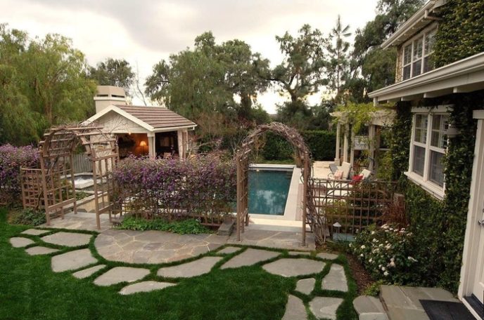 Post_traditional landscape yard with trellis fence and lap pool i_g is19rgzf9q1zp2b d7i_a.jpg