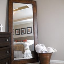 Post_leaner mirror with brown wooden frame on wheat floor matched with wheat wall plus wooden dresser ad white bedding for bedroom decor ideas restoration hardware floor mirror large floor mirrors leaning 680x.jpg