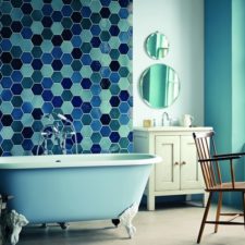 Post_post_interior bathroom furniture cute blue fiberglass stand alone clawfoot tub and blue hexagon glass mosaic tiled wall panel also white wooden bath vanity plus antique brown wooden armchair with shower r.jpg