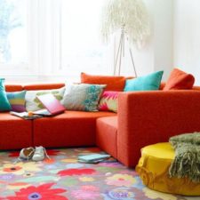 Post_stunning colorful living room rug pictures_colorful floral fabric area rug_red fabric arms loveseats_round yellow fabric ottoman_white modern floor lamp 936x1248.jpg