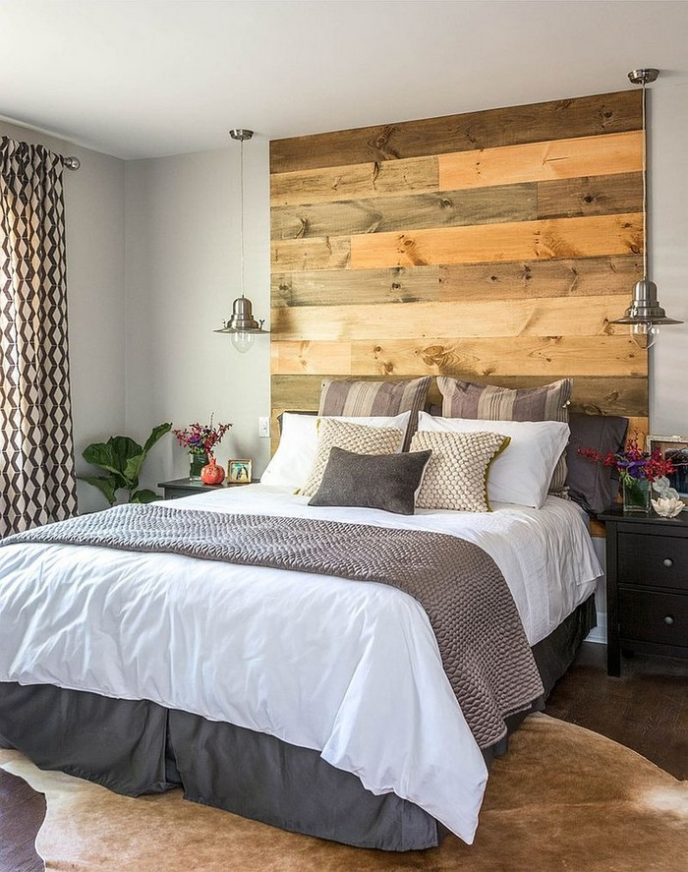 Post_contemporary bedroom with warm accent wood headboard coupled with modern grey white bedding and unique side lamp also bold pattern drapes.jpg