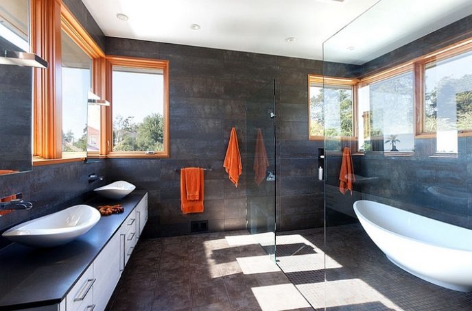 Post_dark bathroom walls offer the ideal background for the orange accents.jpg