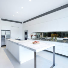 Post_enclave house melbourne australia white kitchen island marble.jpg