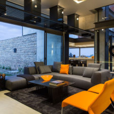 Post_impressive grey nuance house paint colours in south africa with orange seat applied on the black rug on the white modern ceramics floor with wooden coffee table.jpg