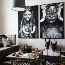 Post_living room with african decor and white walls also hanging black pendant lighting.jpg