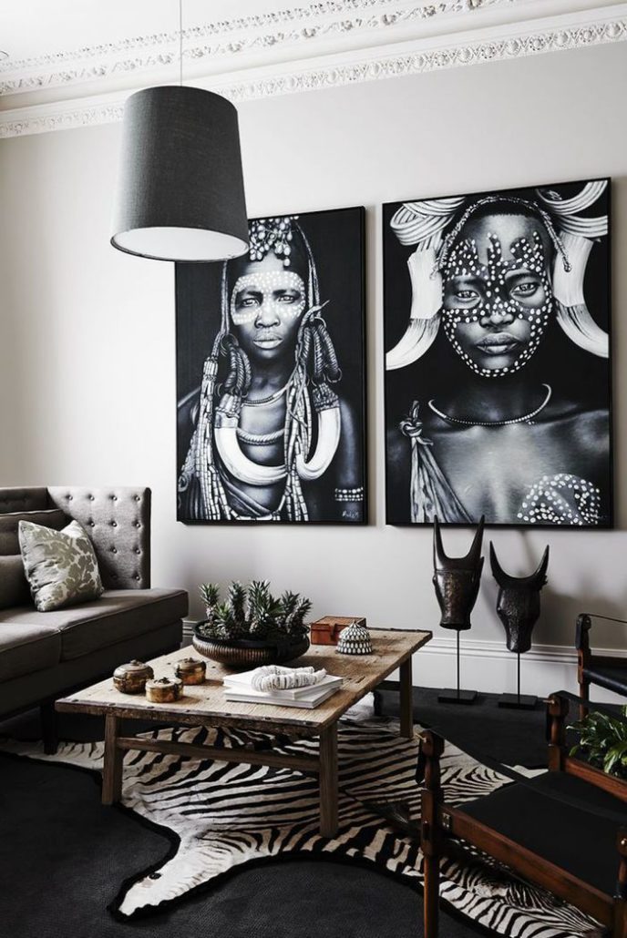 Post_living room with african decor and white walls also hanging black pendant lighting.jpg