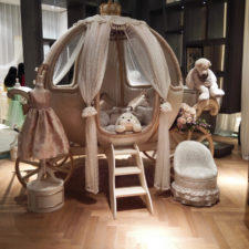 Post_lovely cinderella pumpkin canopy crib_white transparent curtain_small white pattern sofa_white painted cloth hanger_wooden floor_cute bear doll_pricess carriage design_baby girl bedding ideas.jpg