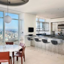 Post_modern living space designed with large panoramic windows at the kitchen and dining area for fascinating city views.jpg