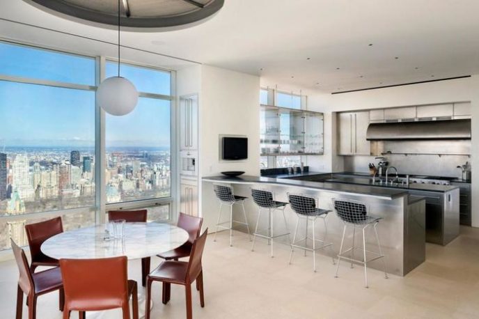 Post_modern living space designed with large panoramic windows at the kitchen and dining area for fascinating city views.jpg