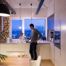 Post_white kitchen cabinet and kitchen countertop_wooden dining table with white chair_simple black pendant lamp_white wall paint_large glass windows.jpg