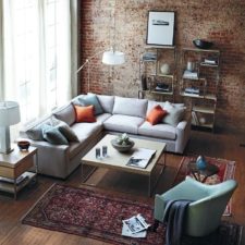 Post_interesting white corner sofa design with brick stone wall also glss window behind sofa including maroon rug on wooden floor plus shelves in the near floor lamps.jpg