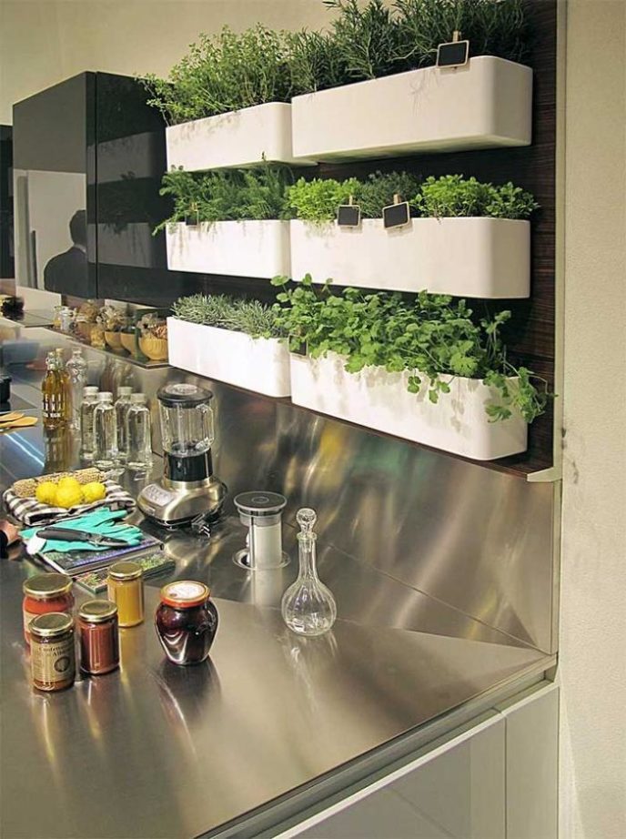 Post_smart mini garden design with small green plants in mounted white pots for decorating a modenr kitchen interior.jpg