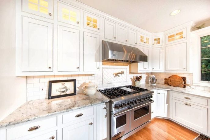 Post_traditional kitchen with white granite countertop herringbone tile and subway tile i_g isly0qyhzgafyn0000000000 wzlae.jpg